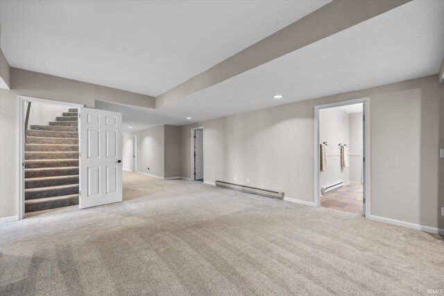 2344 E Linden Hill Dr, Bloomington, IN 47401 - basement featuring a baseboard radiator, light carpet, recessed lighting, baseboards, and stairs