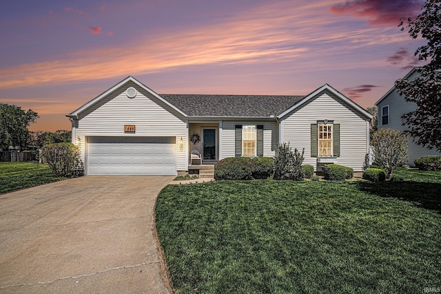 ranch-style home featuring concrete driveway, a lawn, a garage, and roof with shingles