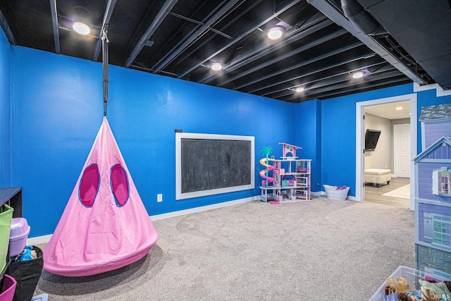 game room with carpet flooring and baseboards