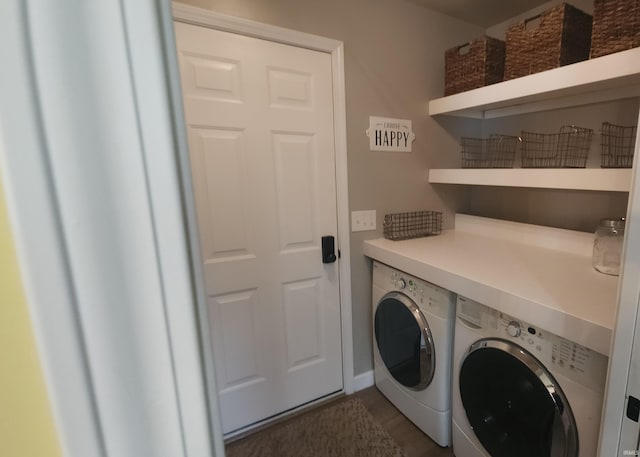 washroom featuring independent washer and dryer and dark wood finished floors