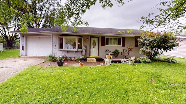 single story home featuring a garage, asphalt driveway, and a front lawn