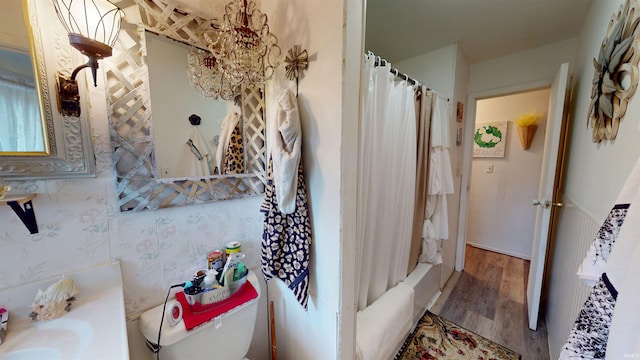full bath featuring toilet and wood finished floors