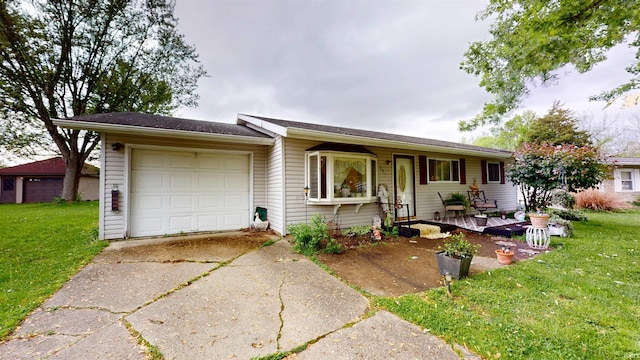 ranch-style house featuring concrete driveway, an attached garage, and a front yard