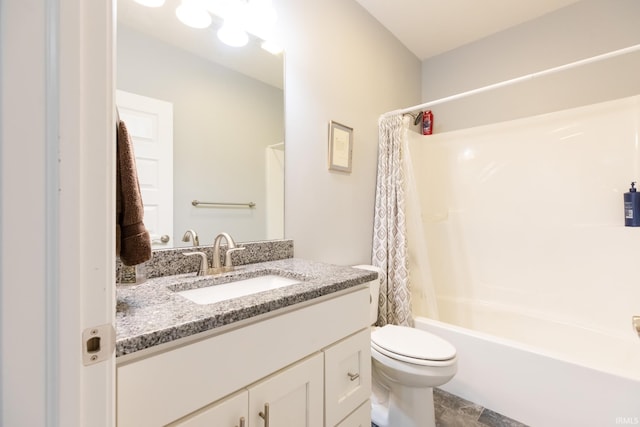 full bathroom featuring toilet, vanity, and shower / bath combination with curtain