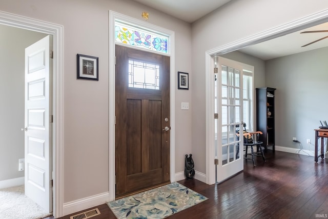 foyer with dark wood-style floors, baseboards, and a ceiling fan