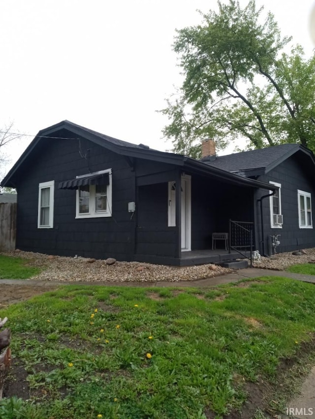 view of front of home with a chimney