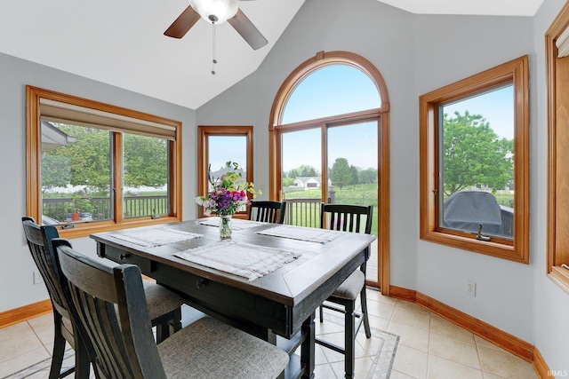 2102 Hunters Ct, Auburn, IN 46706 - dining space with plenty of natural light, vaulted ceiling, baseboards, ceiling fan, and light tile patterned floors