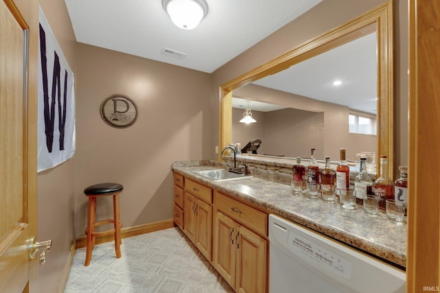 2102 Hunters Ct, Auburn, IN 46706 - indoor wet bar with dishwasher and baseboards