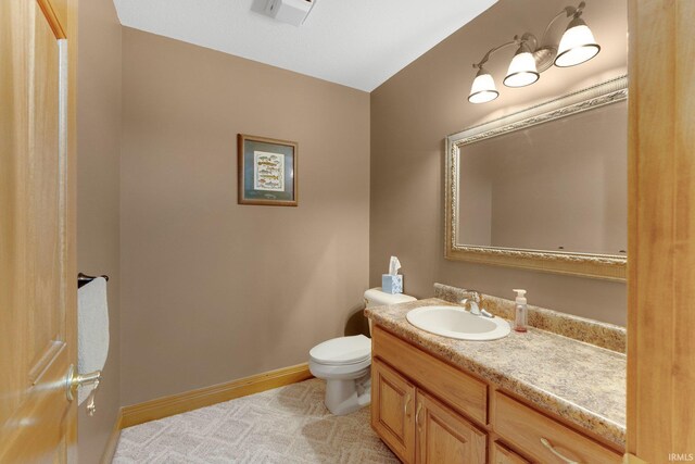 2102 Hunters Ct, Auburn, IN 46706 - half bath with vanity, toilet, and baseboards