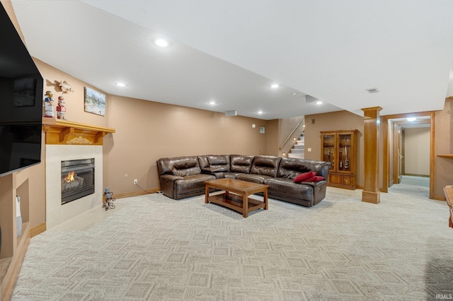 2102 Hunters Ct, Auburn, IN 46706 - living room with stairs, a tile fireplace, light carpet, baseboards, and recessed lighting
