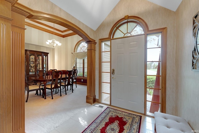 2102 Hunters Ct, Auburn, IN 46706 - foyer with a chandelier, light carpet, light tile patterned floors, and high vaulted ceiling