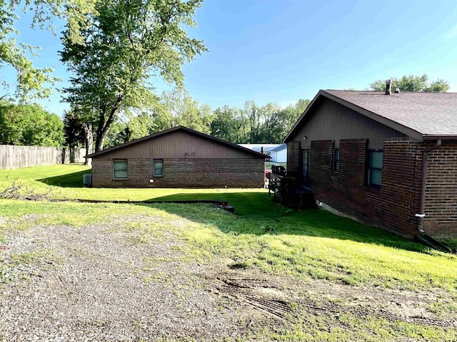 view of property exterior featuring brick siding