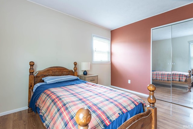 3721 W Maybury Mall, Bloomington, IN 47403 - bedroom with baseboards, wood finished floors, and a closet