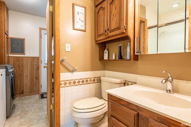 3721 W Maybury Mall, Bloomington, IN 47403 - bathroom featuring wainscoting, washer and clothes dryer, electric panel, toilet, and vanity
