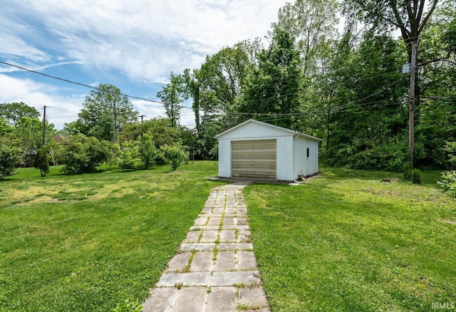 3721 W Maybury Mall, Bloomington, IN 47403 - view of green lawn featuring a garage, an outdoor structure, and driveway
