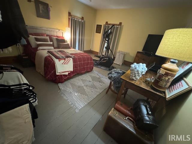 bedroom featuring baseboards