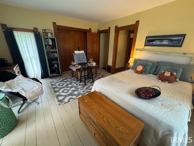 bedroom with light wood finished floors
