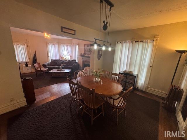 dining area with wood finished floors and baseboards