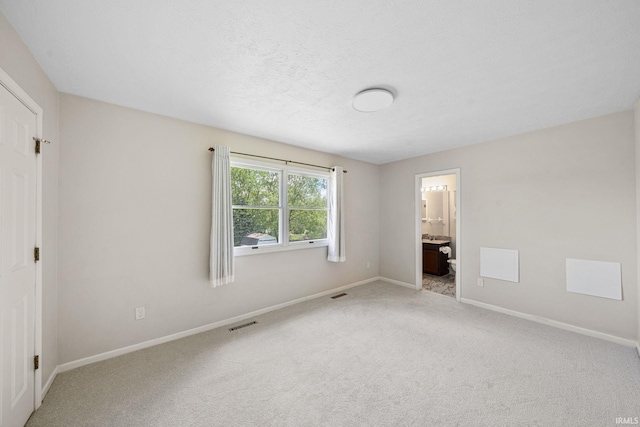 50880 Cherry Farm Trl, Granger, IN 46530 - unfurnished bedroom featuring baseboards, carpet, and ensuite bath