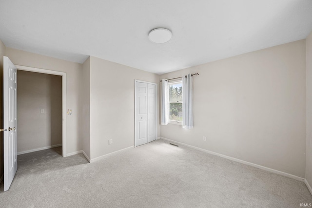 50880 Cherry Farm Trl, Granger, IN 46530 - unfurnished bedroom with carpet floors, baseboards, and a closet