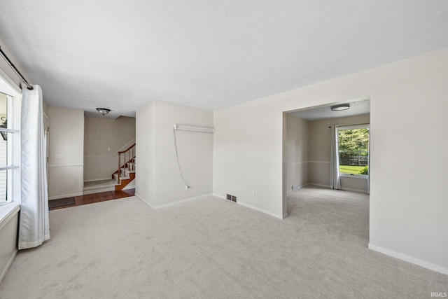50880 Cherry Farm Trl, Granger, IN 46530 - empty room with carpet flooring, stairs, and baseboards