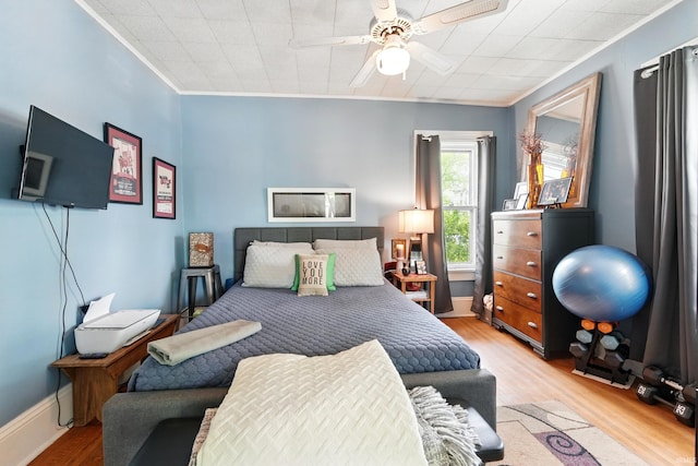 1021 W Wayne St, Fort Wayne, IN 46802 - bedroom with ornamental molding, wood finished floors, and a ceiling fan