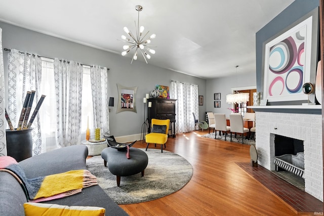 1021 W Wayne St, Fort Wayne, IN 46802 - living room with a chandelier, wood finished floors, and baseboards