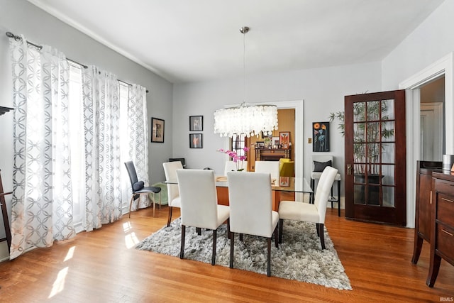 1021 W Wayne St, Fort Wayne, IN 46802 - dining area featuring a chandelier and wood finished floors