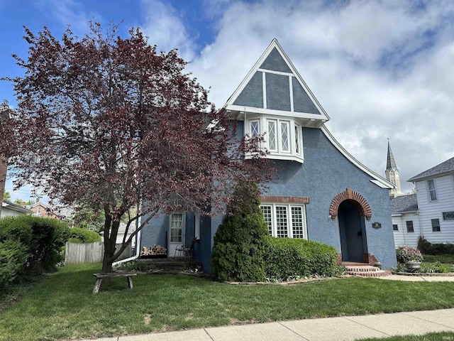 216 W 3rd St, Peru, IN 46970 - tudor home with stucco siding