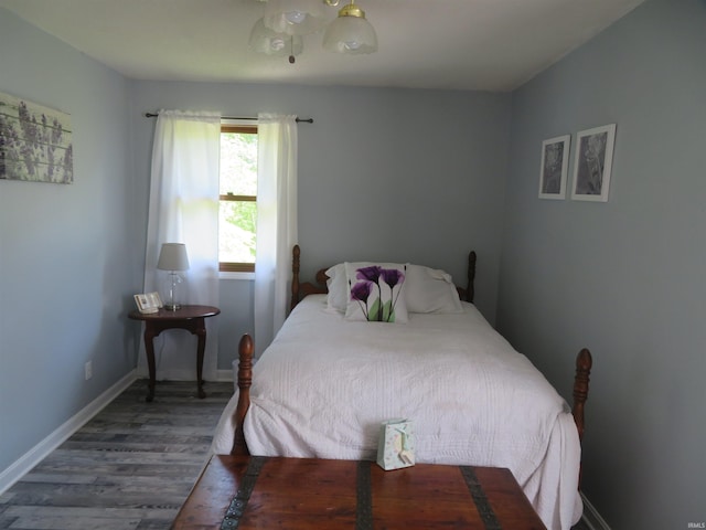 1243 Bellgrade Ave, Loogootee, IN 47553 - bedroom featuring wood finished floors and baseboards