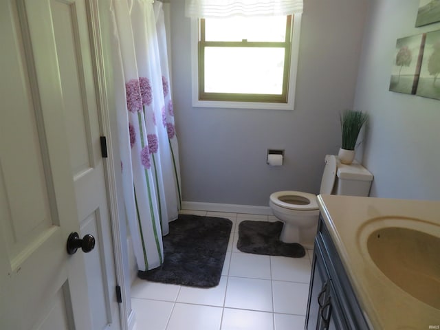 1243 Bellgrade Ave, Loogootee, IN 47553 - bathroom with vanity, toilet, tile patterned floors, and curtained shower