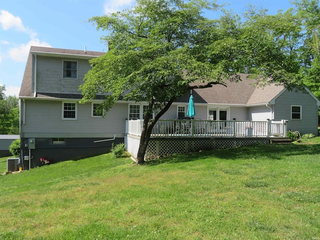 1243 Bellgrade Ave, Loogootee, IN 47553 - rear view of property featuring a deck, a yard, cooling unit, and a shingled roof