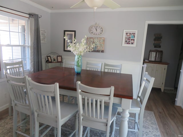 1243 Bellgrade Ave, Loogootee, IN 47553 - dining area with wood finished floors, crown molding, and a ceiling fan