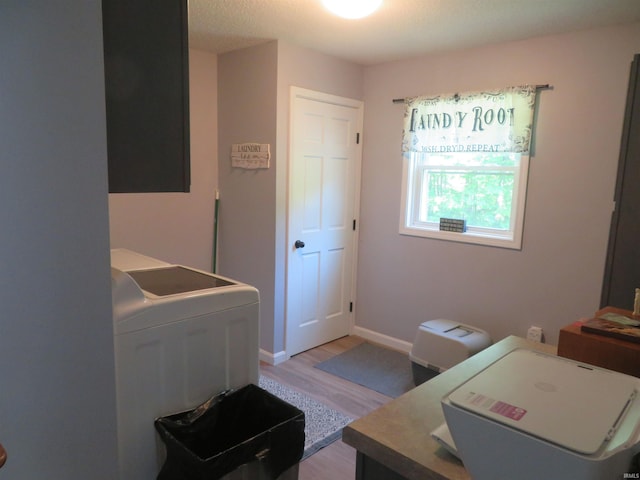 1243 Bellgrade Ave, Loogootee, IN 47553 - washroom featuring light wood-style flooring, washer and clothes dryer, and baseboards