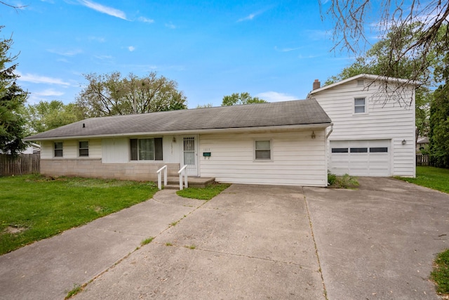 1317 W Tate St, Kokomo, IN 46901 - view of front of property featuring driveway, roof with shingles, and a garage