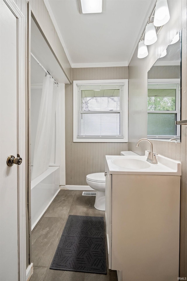 1317 W Tate St, Kokomo, IN 46901 - bathroom featuring vanity, toilet, crown molding, shower / bath combo, and wooden walls