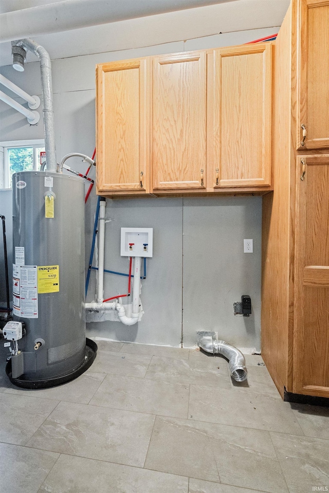 1317 W Tate St, Kokomo, IN 46901 - clothes washing area featuring water heater and cabinet space
