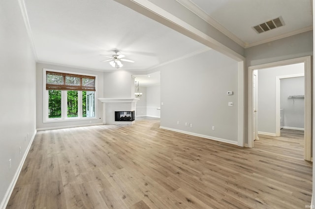 12908 Chaplin Ct, Fort Wayne, IN 46845 - unfurnished living room featuring ceiling fan, ornamental molding, light wood-style flooring, baseboards, and a glass covered fireplace