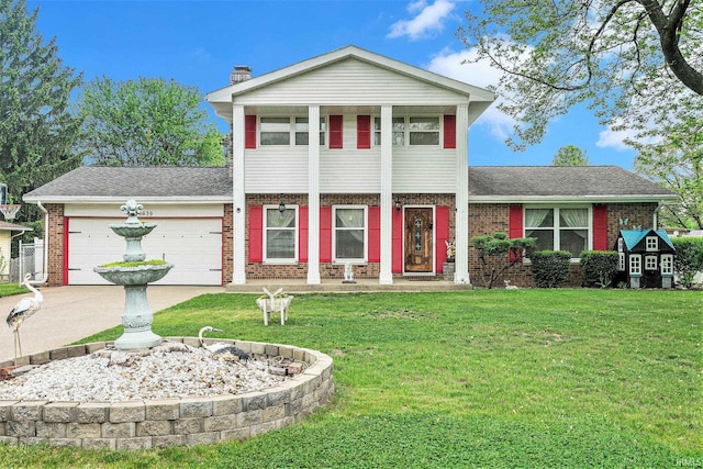 56635 N Wedgewood Ave, Elkhart, IN 46516 - view of front of house featuring brick siding, a front lawn, and an attached garage