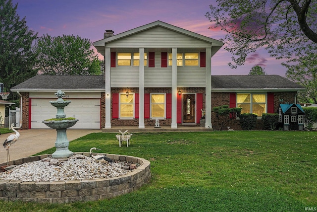 56635 N Wedgewood Ave, Elkhart, IN 46516 - view of front of house with brick siding, a front lawn, an attached garage, driveway, and a chimney