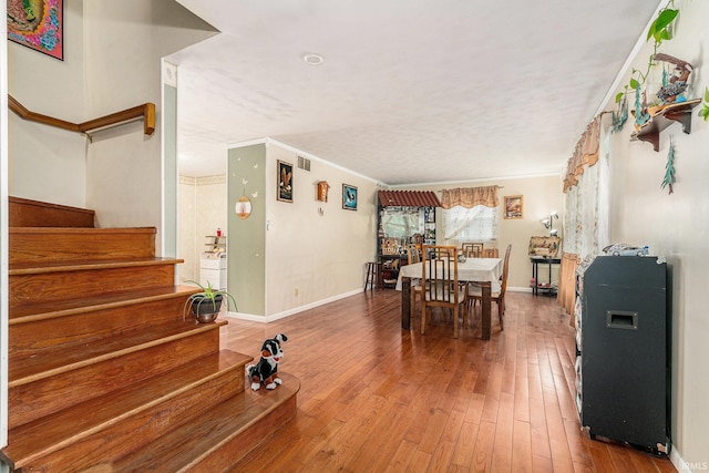 56635 N Wedgewood Ave, Elkhart, IN 46516 - dining area with stairway, hardwood / wood-style flooring, baseboards, and ornamental molding