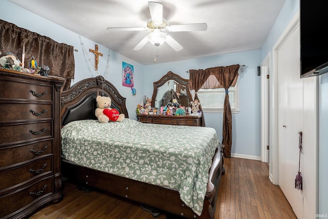 56635 N Wedgewood Ave, Elkhart, IN 46516 - bedroom with hardwood / wood-style flooring, baseboards, ceiling fan, and multiple windows