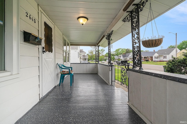 balcony featuring a porch and a residential view