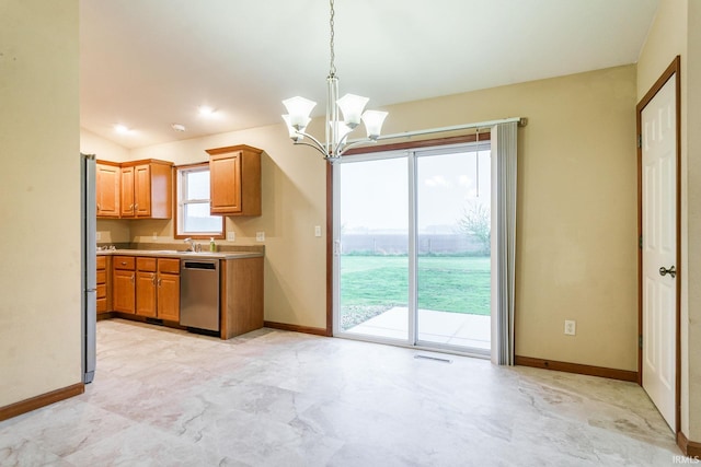 kitchen featuring stainless steel dishwasher, baseboards, hanging light fixtures, lofted ceiling, and a chandelier