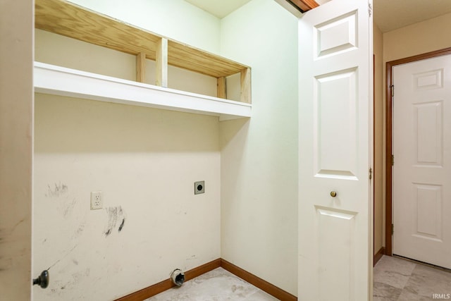 laundry room with hookup for an electric dryer and baseboards