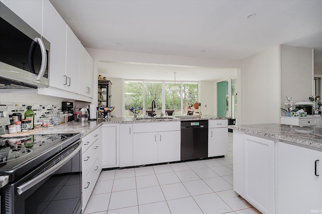 4207 Lance Ct, Kokomo, IN 46902 - kitchen with black appliances, a sink, tasteful backsplash, white cabinetry, and light stone countertops