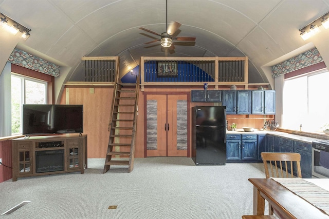59000 Crumstown Hwy, North Liberty, IN 46554 - kitchen featuring freestanding refrigerator, ceiling fan, vaulted ceiling, healthy amount of natural light, and light colored carpet