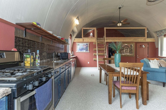 59000 Crumstown Hwy, North Liberty, IN 46554 - kitchen featuring appliances with stainless steel finishes, a sink, a ceiling fan, light carpet, and vaulted ceiling