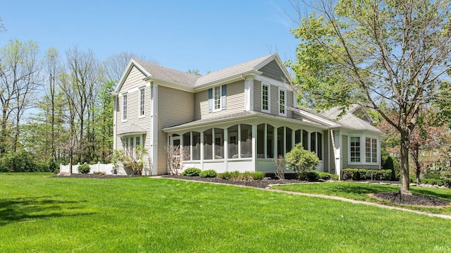 14612 Liberty Mills Rd, Fort Wayne, IN 46814 - view of front of home featuring a sunroom, a front yard, and roof with shingles