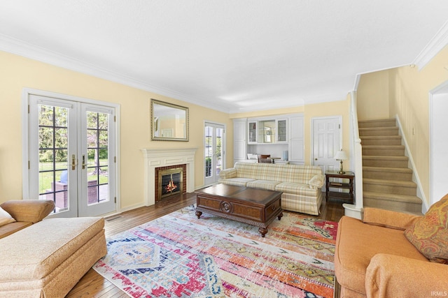 14612 Liberty Mills Rd, Fort Wayne, IN 46814 - living room with crown molding, plenty of natural light, french doors, wood finished floors, and stairway